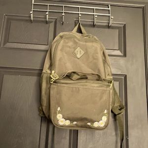 Green backpack with lunch bag